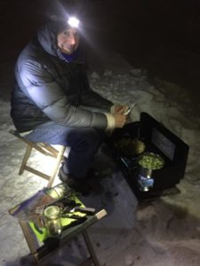 Ed assisting with dinner on a camp stove, peeling potatoes from his garden in Des Moines as Lyssa boils brussels sprouts and prepares vegetarian meatloaf. Photo by Lyssa Wade.