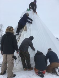 Tipi under construction during the storm.